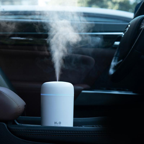 Humidificador de aire portátil con difusor de aceites esenciales para coche y hogar.